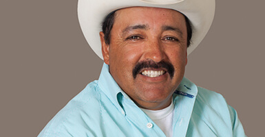 Man with a cowboy hat on smiling